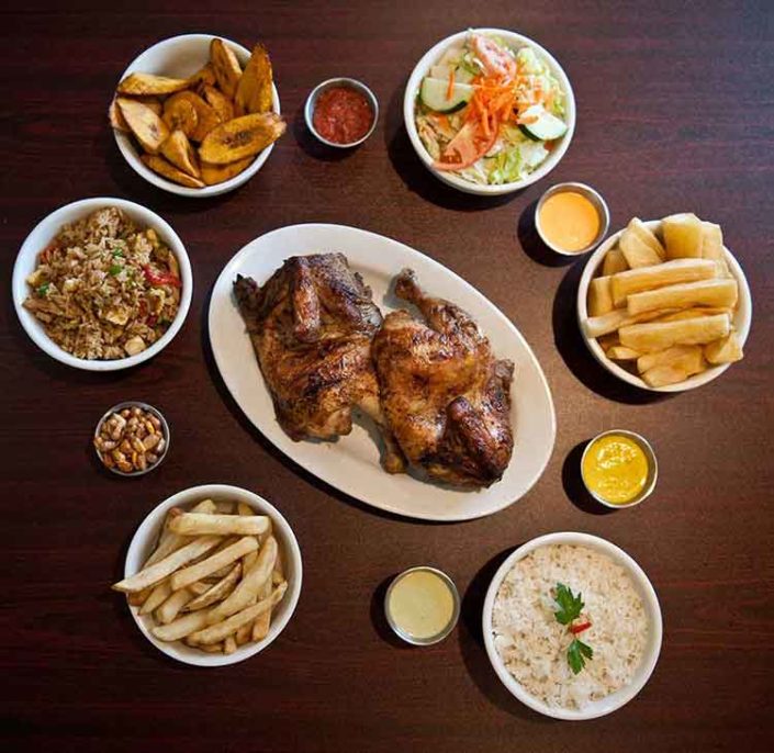 Whole chicken with different sides and sauces